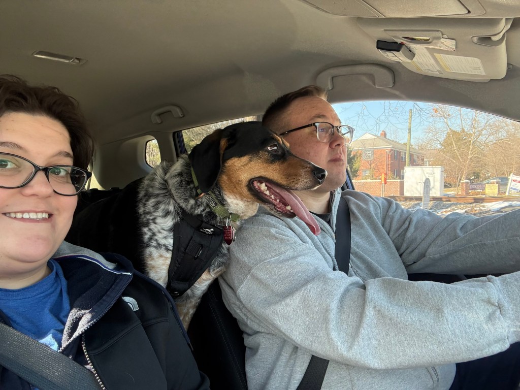 Josh, Jahnna, and Eddie go for a ride in Betty Bluecar. Eddie is on the center console with a big tongue-out smiley dog face because he loves a car ride and errands.